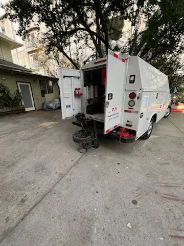 Magnet Plumbing service vehicle on-site for Grease Trap Cleaning in Haven Homes